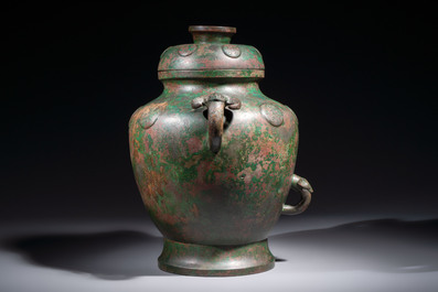 A large Chinese archaistic bronze wine vessel and cover with ram-form handles, Lei 罍, Ming