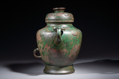 A large Chinese archaistic bronze wine vessel and cover with ram-form handles, Lei 罍, Ming