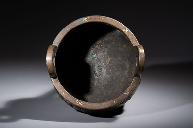 A rare Chinese gold- and silver-inlaid bronze 'Ding' censer with Taotie design on a hongmu stand, Shaosheng 紹聖 and Su Zhe 蘇轍 mark, Song or later