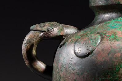 A large Chinese archaistic bronze wine vessel and cover with ram-form handles, Lei 罍, Ming
