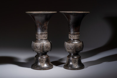 A pair of Chinese archaistic bronze 'Gu' vases, 18th C.