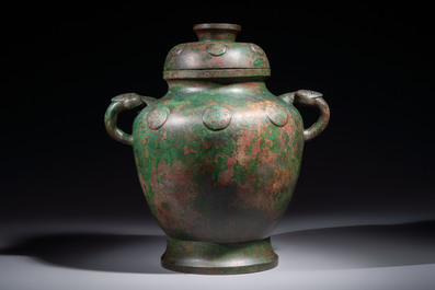 A large Chinese archaistic bronze wine vessel and cover with ram-form handles, Lei 罍, Ming