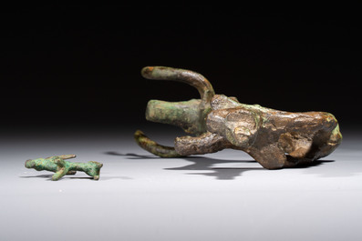 An Anatolian copper-alloy standard surmounted by a long-horned bull and a Luristan deer, 1st millennium BC.