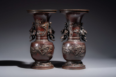 A pair of Japanese bronze vases with relief design of birds among flowering branches, signed Hasegawa Harusada 長谷川晴定, 19th C.