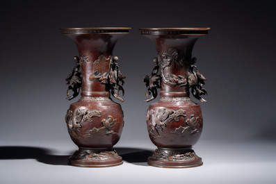 A pair of Japanese bronze vases with relief design of birds among flowering branches, signed Hasegawa Harusada 長谷川晴定, 19th C.