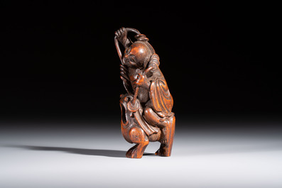 A small Chinese carved bamboo group of 'Liuhai', 19th C.