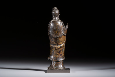 A Chinese bronze standing Guanyin with boy, Ming