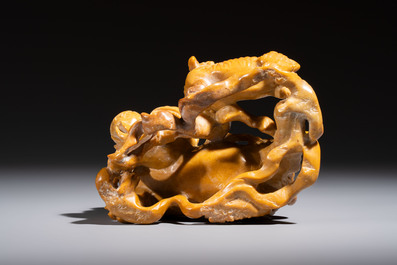 A fine Chinese soapstone group of Buddhist lions on wooden stand, 19th C.