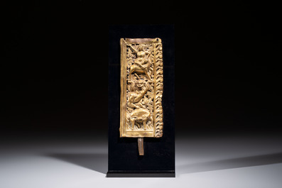 A fine Tibetan gilt-copper repouss&eacute; plaque depicting a Dharmapala, a lion and an elephant, on a later mount, 18th C.
