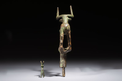 An Anatolian copper-alloy standard surmounted by a long-horned bull and a Luristan deer, 1st millennium BC.