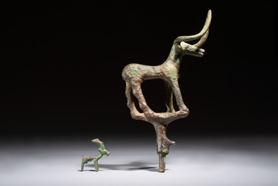 An Anatolian copper-alloy standard surmounted by a long-horned bull and a Luristan deer, 1st millennium BC.