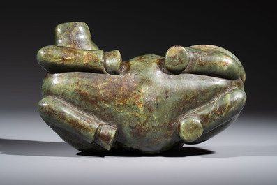 A Chinese green jade reclining buffalo on a wooden stand, 19/20th C.