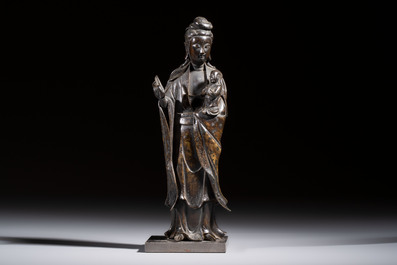 A Chinese bronze standing Guanyin with boy, Ming