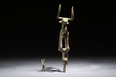 An Anatolian copper-alloy standard surmounted by a long-horned bull and a Luristan deer, 1st millennium BC.