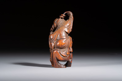 A small Chinese carved bamboo group of 'Liuhai', 19th C.