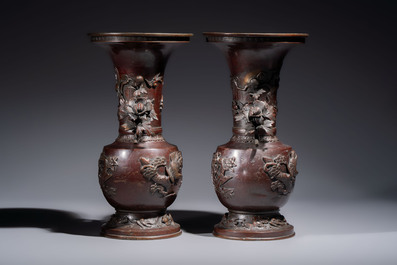 A pair of Japanese bronze vases with relief design of birds among flowering branches, signed Hasegawa Harusada 長谷川晴定, 19th C.