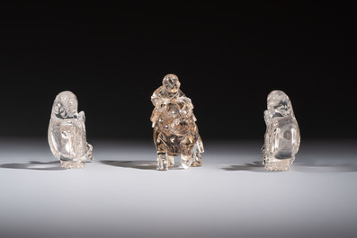 Three Chinese rock crystal sculptures on wooden stands, Republic