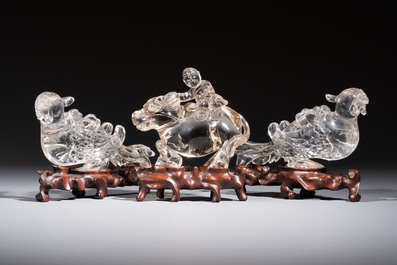 Three Chinese rock crystal sculptures on wooden stands, Republic