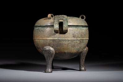 A Chinese archaic bronze tripod food vessel and cover, Ding 鼎, Eastern Zhou