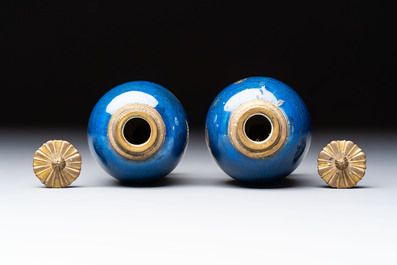 A Chinese powder-blue-ground gilt-decorated spittoon and two gilt-bronze-mounted vases, 18th C.