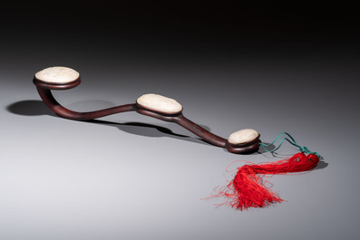 A Chinese white-jade-inset hongmu ruyi with a wooden presentation box and display case, 19th C.