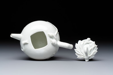 A Chinese Dehua blanc de Chine 'Pomegranate' teapot and cover, Kangxi