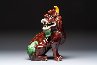 A Chinese sancai-glazed Xiezhi on a wooden stand, 19th C.