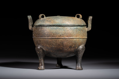 A Chinese archaic bronze tripod food vessel and cover, Ding 鼎, Eastern Zhou
