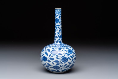 A rare Chinese 'G-marked' blue and white bottle vase with floral design, Kangxi