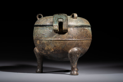A Chinese archaic bronze tripod food vessel and cover, Ding 鼎, Eastern Zhou