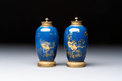 A Chinese powder-blue-ground gilt-decorated spittoon and two gilt-bronze-mounted vases, 18th C.