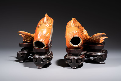 A pair of Chinese coral-red-glazed gilt-decorated 'Goldfish' wall pocket vases on wooden stands, Republic