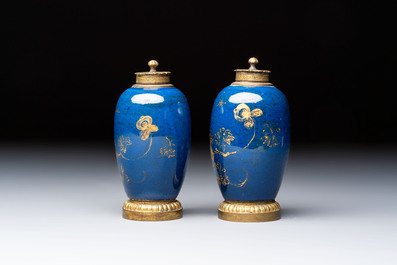 A Chinese powder-blue-ground gilt-decorated spittoon and two gilt-bronze-mounted vases, 18th C.