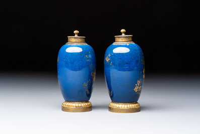 A Chinese powder-blue-ground gilt-decorated spittoon and two gilt-bronze-mounted vases, 18th C.