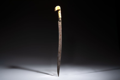 Two Ottoman yatagan swords, one with a silver scabbard, Turkey, 19th C.