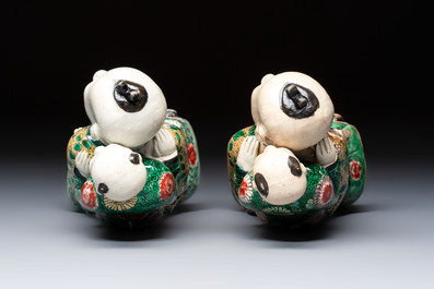 A pair of Chinese verte biscuit 'Piggyback Boys' groups, Kangxi