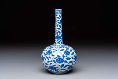 A rare Chinese 'G-marked' blue and white bottle vase with floral design, Kangxi