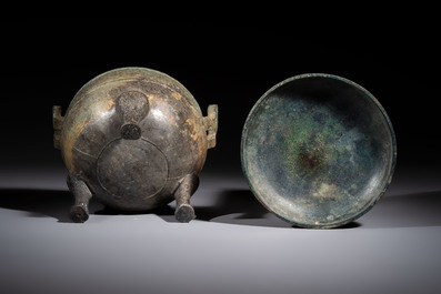 A Chinese archaic bronze tripod food vessel and cover, Ding 鼎, Eastern Zhou