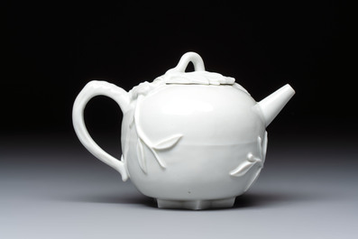 A Chinese Dehua blanc de Chine 'Pomegranate' teapot and cover, Kangxi