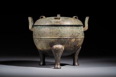 A Chinese archaic bronze tripod food vessel and cover, Ding 鼎, Eastern Zhou