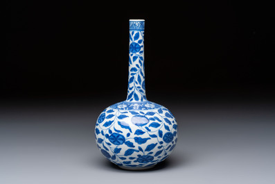 A rare Chinese 'G-marked' blue and white bottle vase with floral design, Kangxi