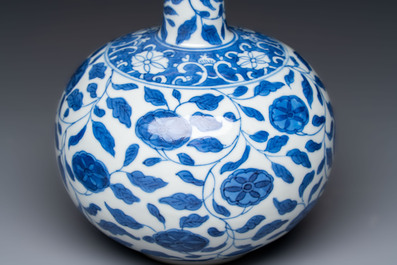 A rare Chinese 'G-marked' blue and white bottle vase with floral design, Kangxi