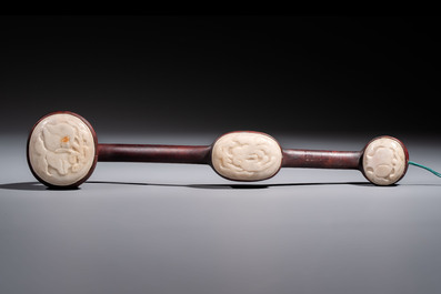 A Chinese white-jade-inset hongmu ruyi with a wooden presentation box and display case, 19th C.