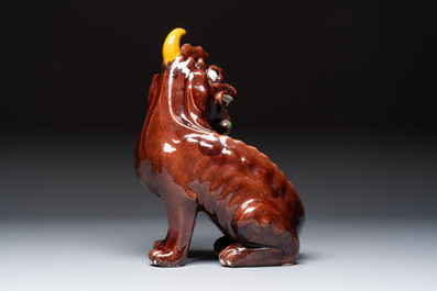 A Chinese sancai-glazed Xiezhi on a wooden stand, 19th C.