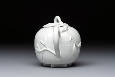 A Chinese Dehua blanc de Chine 'Pomegranate' teapot and cover, Kangxi