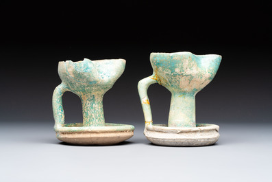A small turquoise-glazed albarello and three oil lamps, Iran or Syria, 12/13th C.