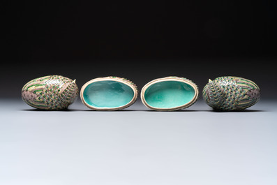 A pair of Chinese turquoise-glazed ducks and a pair of verte biscuit quail-form covered boxes, 20th C.
