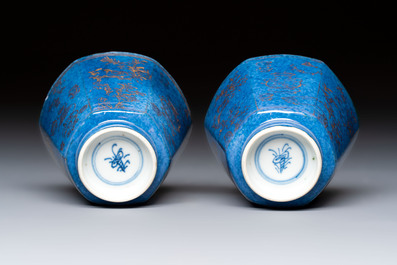A pair of Chinese gilt-decorated powder-blue-ground 'Antiquities' cups and saucers, lingzhi mark, Kangxi