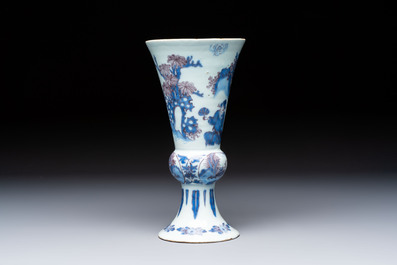 An extremely rare blue, white and manganese Dutch Delft chinoiserie beaker vase after a silver model, late 17th C.