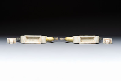 A pair of Chinese verte biscuit 'Shou' wine ewers, 19th C.
